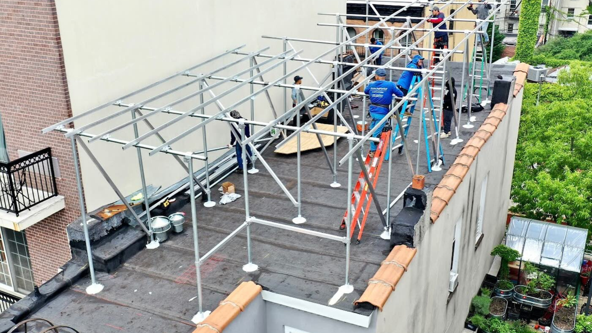 Kamtech Solar team installing rooftop solar racking system in New York City, preparing a durable framework for a commercial solar panel setup. Kamtech Solar team installing rooftop solar racking system in New York City, preparing a durable framework for a commercial solar panel setup.