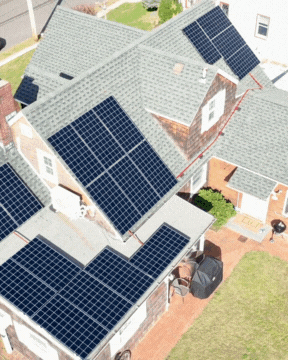 Aerial video of Kamtech Solar residential rooftop installation featuring multiple solar panel arrays generating clean renewable energy for a home. Aerial video of Kamtech Solar residential rooftop installation featuring multiple solar panel arrays generating clean renewable energy for a home.