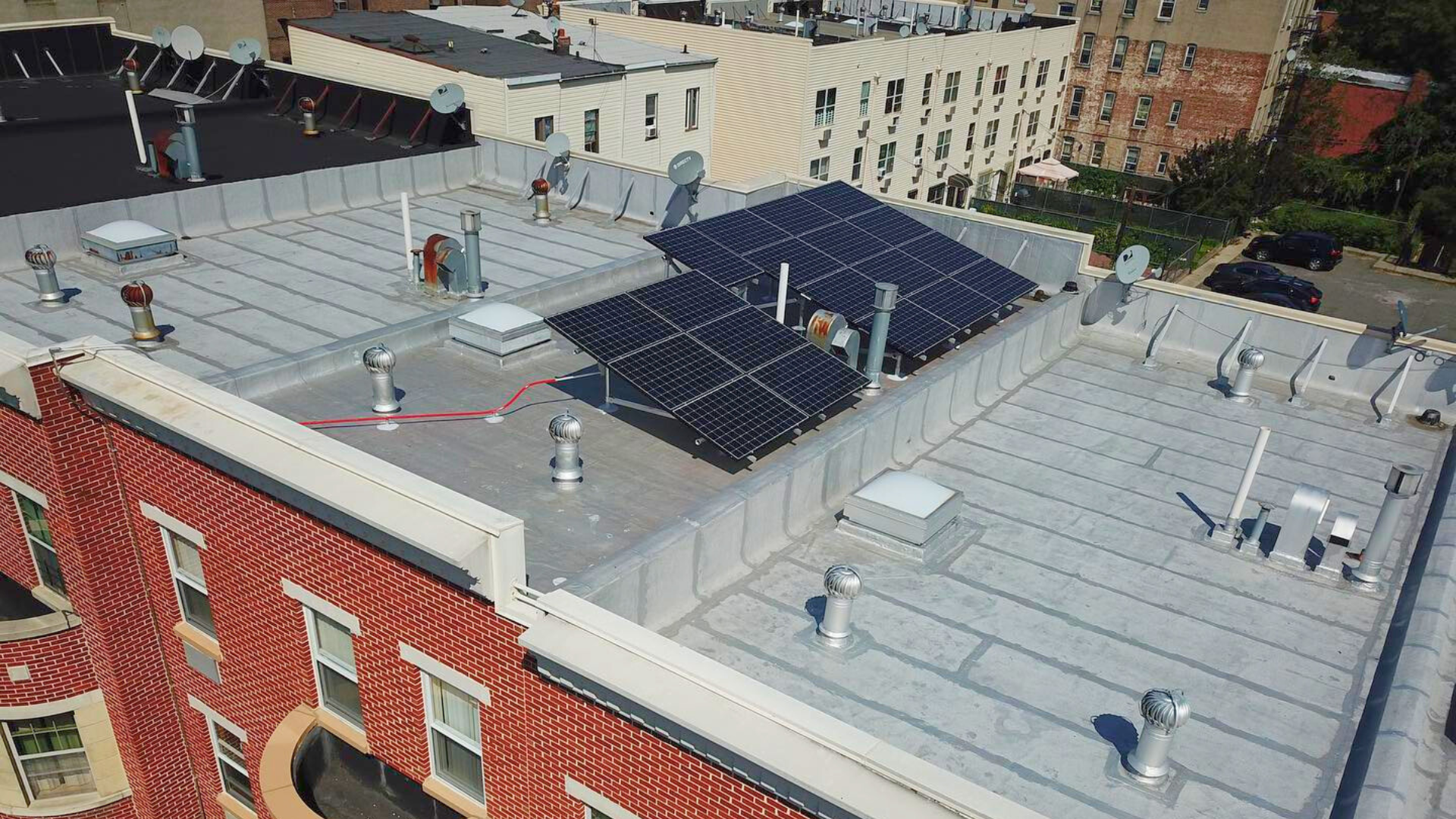 Kamtech Solar rooftop solar panel installation in New York, showcasing efficient flat-roof solar design for urban energy savings. Kamtech Solar rooftop solar panel installation in New York, showcasing efficient flat-roof solar design for urban energy savings.