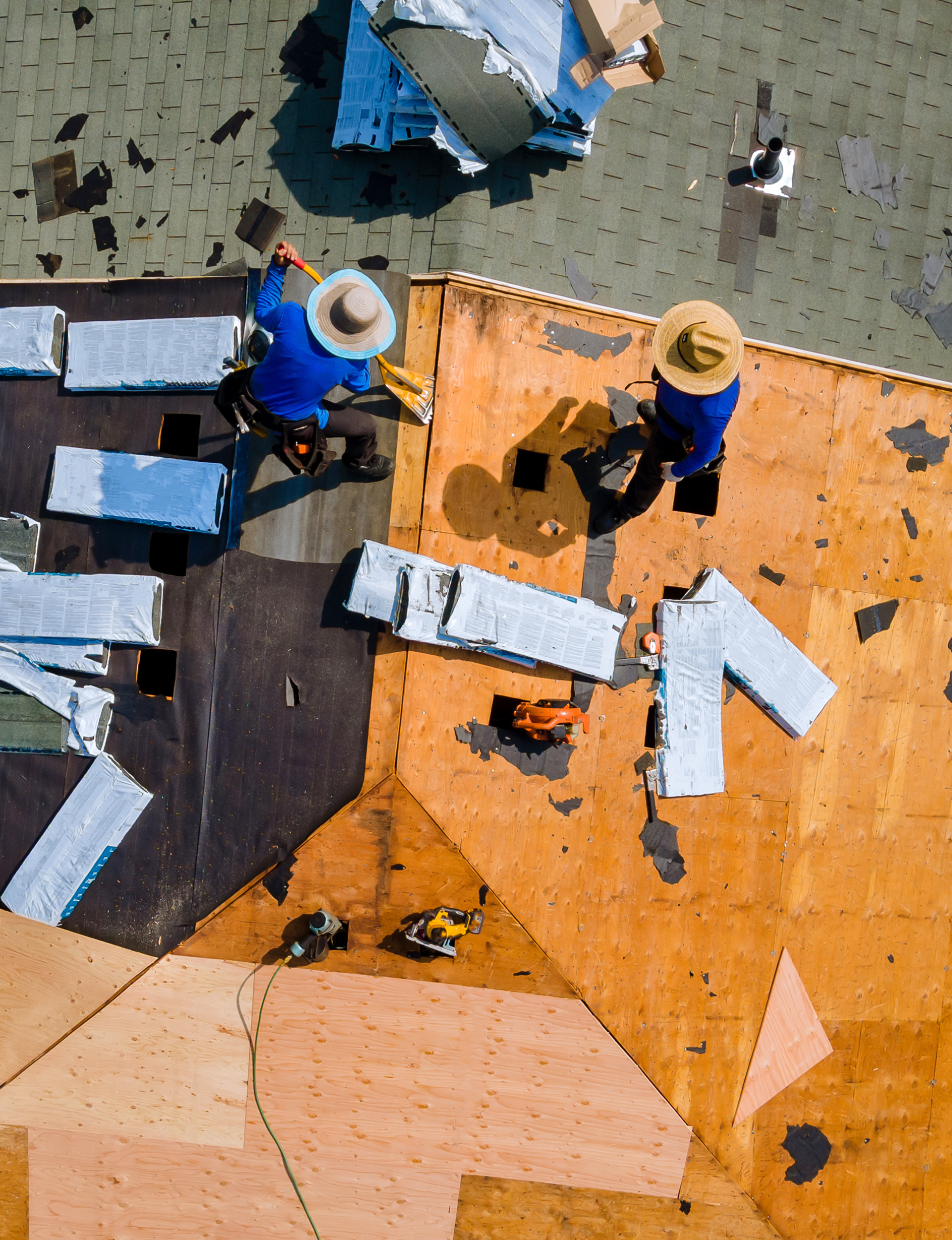 Kamtech Solar roofing team completing a roof installation with new plywood decking and underlayment during a solar-ready roof upgrade.