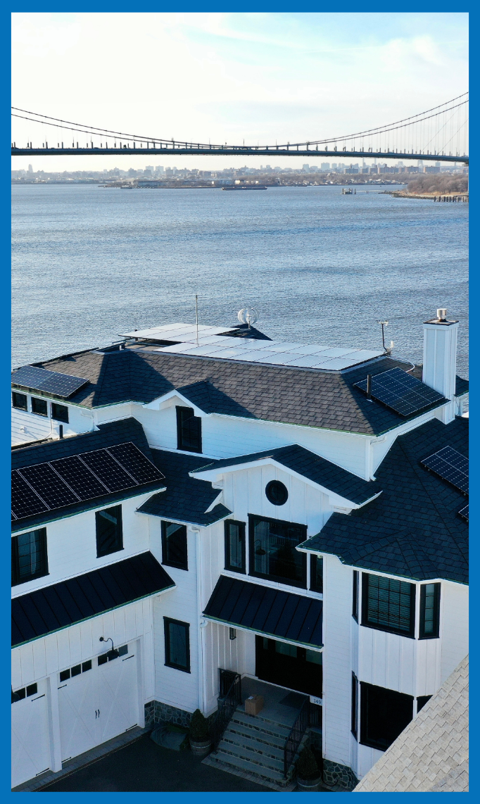 Kamtech Solar residential solar panel installation on a waterfront home near bridge, showcasing modern energy efficiency and sustainable design. Referral Program Part 2