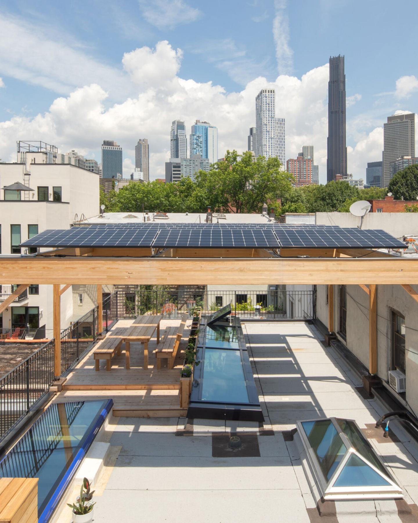 8 kW rooftop photovoltaic canopy at 475 High Performance Building Supply, Brooklyn NY — solar system designed, permitted, and installed by Kamtech Solar