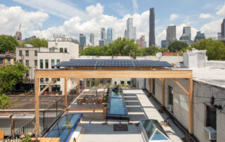 8 kW rooftop photovoltaic canopy at 475 High Performance Building Supply, Brooklyn NY — solar system designed, permitted, and installed by Kamtech Solar